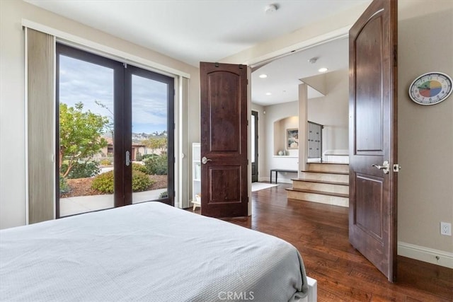 bedroom featuring baseboards, dark wood-style flooring, access to outside, french doors, and recessed lighting