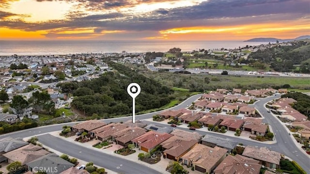 aerial view featuring a water view and a residential view