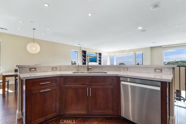 kitchen with dishwasher, dark wood-style flooring, a sink, and decorative light fixtures