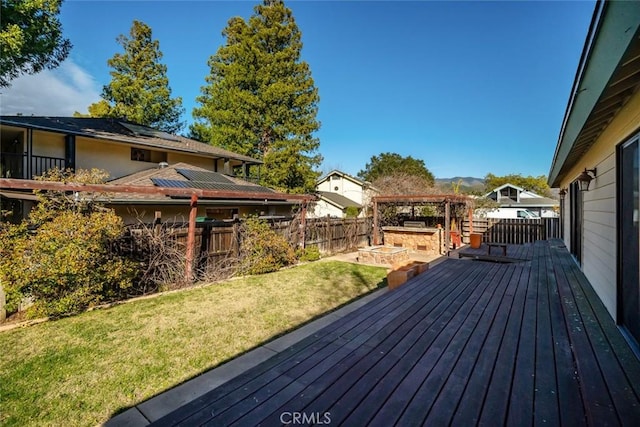 deck with a yard, fence, and a gazebo