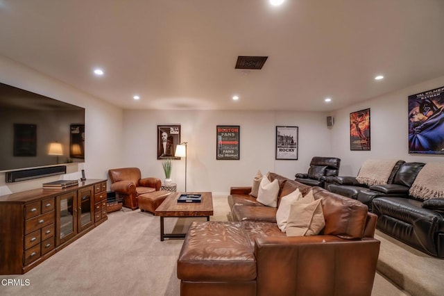 living area with recessed lighting and light colored carpet