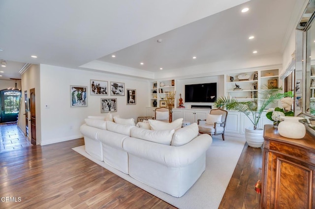 living room featuring wood finished floors, baseboards, and recessed lighting