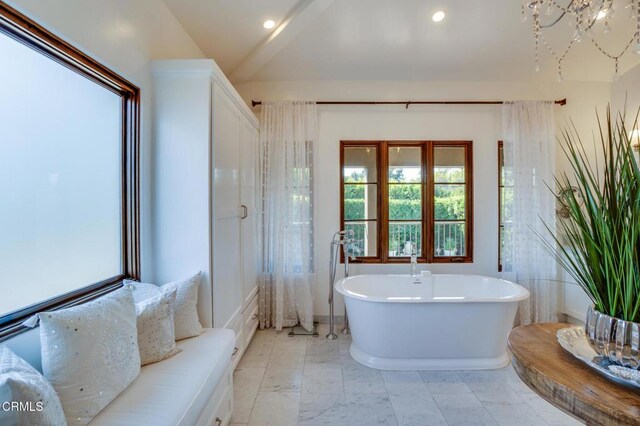 full bathroom with recessed lighting and a soaking tub