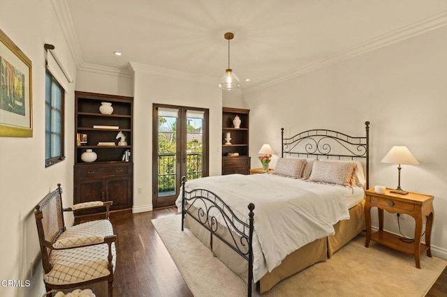 bedroom with french doors, crown molding, wood finished floors, and baseboards