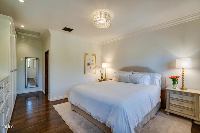 bedroom featuring dark wood-style flooring, ornamental molding, baseboards, and recessed lighting