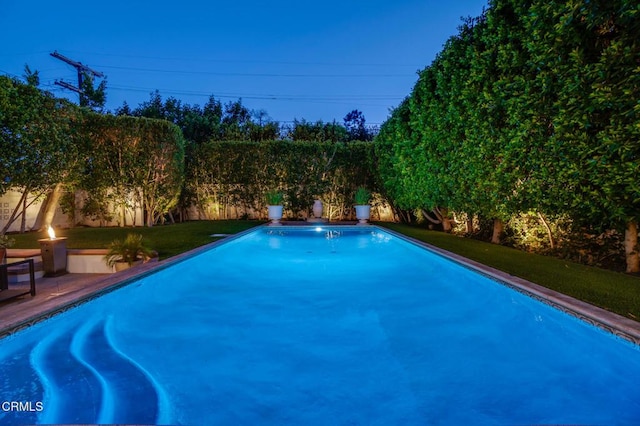 view of pool with a fenced in pool, a yard, and a fenced backyard