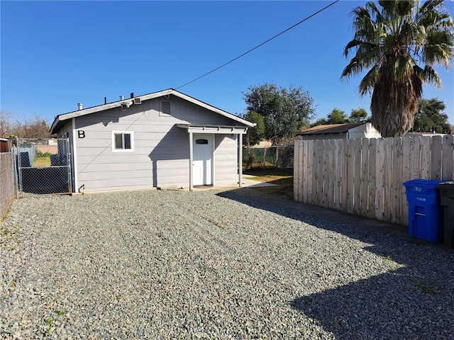 view of outbuilding with fence