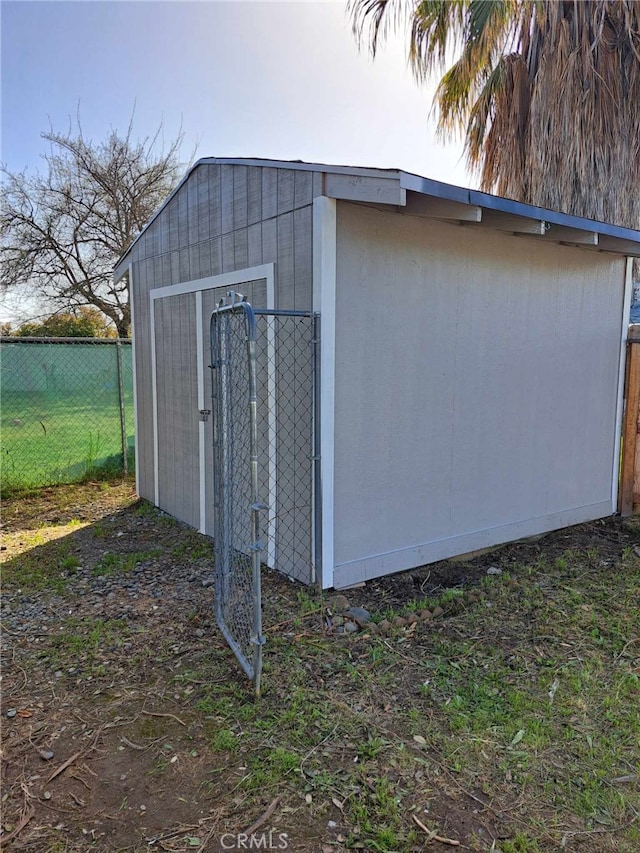 view of shed with fence