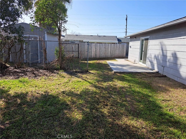 view of yard featuring a fenced backyard and a patio