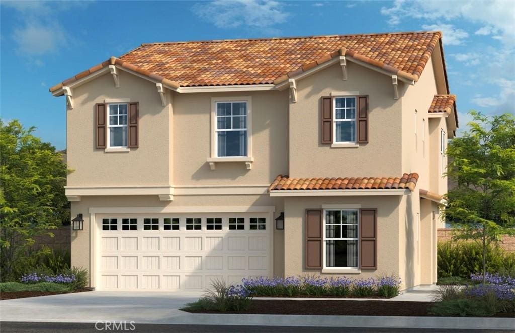 mediterranean / spanish home with driveway, a tiled roof, and stucco siding