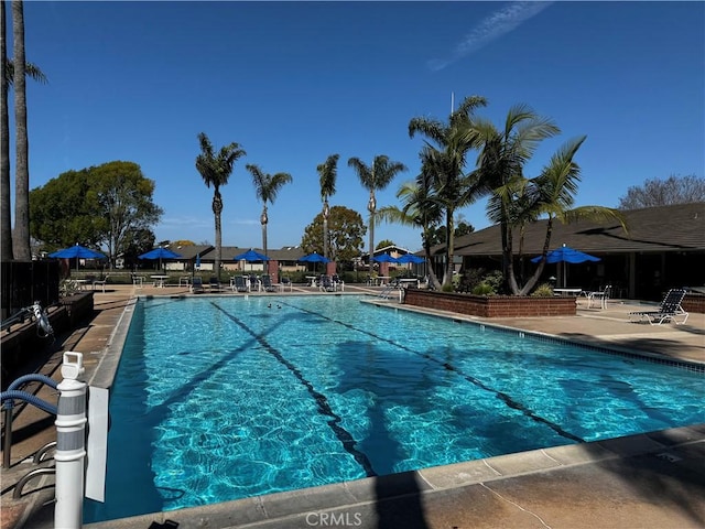 community pool with a patio area