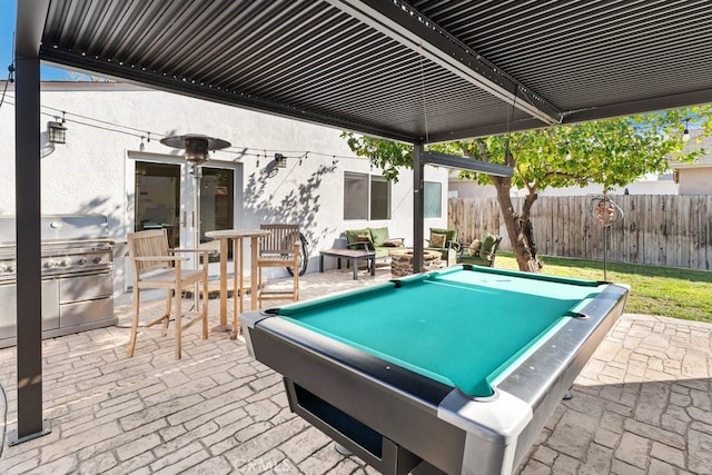 view of patio featuring french doors, area for grilling, and fence