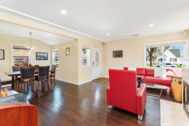 living room featuring baseboards, visible vents, dark wood-style flooring, and recessed lighting