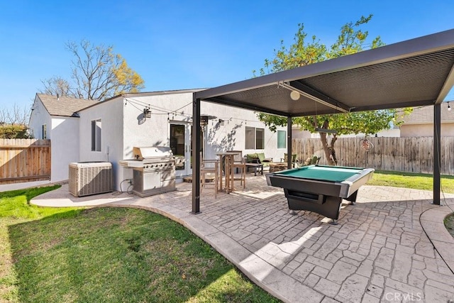 view of patio with a fenced backyard, central AC unit, and grilling area