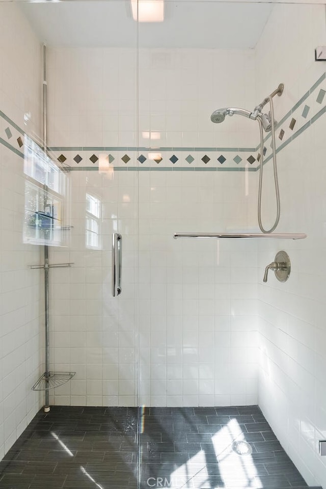 bathroom with a shower stall