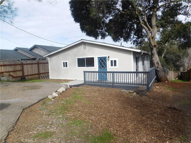 14370 Ridge Rd, Clearlake, CA 95422 - back of property with fence, a deck, and stucco siding