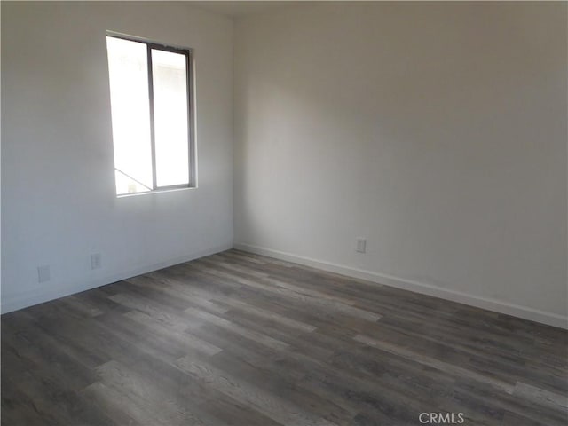 14370 Ridge Rd, Clearlake, CA 95422 - unfurnished room with dark wood-type flooring and baseboards