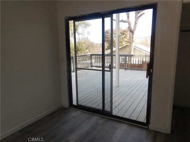14370 Ridge Rd, Clearlake, CA 95422 - doorway to outside featuring baseboards and dark wood-type flooring