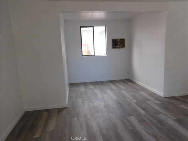 14370 Ridge Rd, Clearlake, CA 95422 - empty room with dark wood finished floors and baseboards