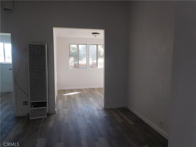 14370 Ridge Rd, Clearlake, CA 95422 - spare room featuring a heating unit, dark wood finished floors, and baseboards