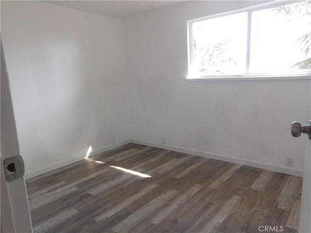 14370 Ridge Rd, Clearlake, CA 95422 - empty room featuring dark wood-style floors and baseboards