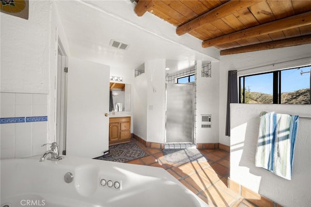 bathroom featuring wooden ceiling, beam ceiling, vanity, a whirlpool tub, and visible vents
