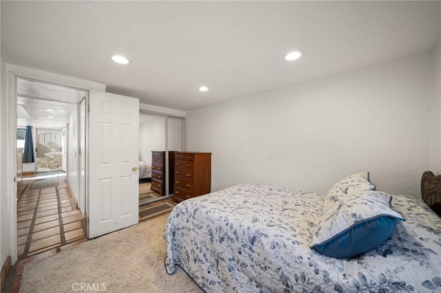 bedroom featuring recessed lighting and a closet