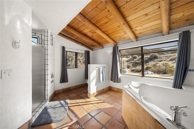 full bath with baseboards, wood ceiling, vaulted ceiling with beams, tile patterned flooring, and a bath