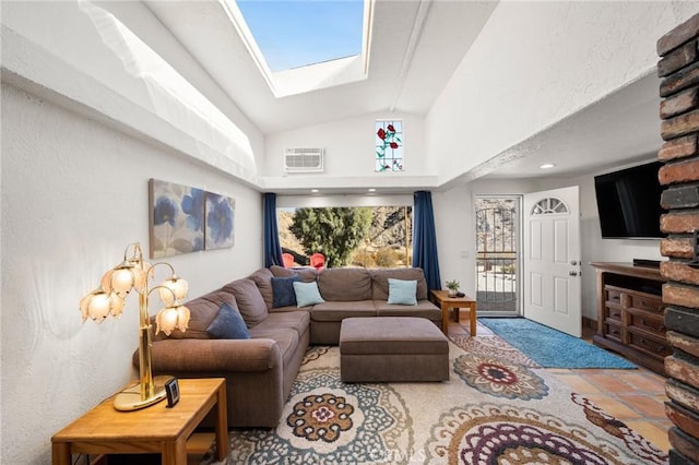 living area featuring vaulted ceiling with skylight and visible vents