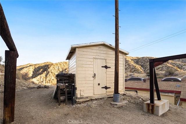 view of shed with a mountain view