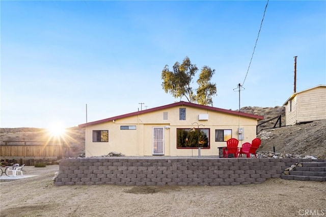back of house featuring stucco siding