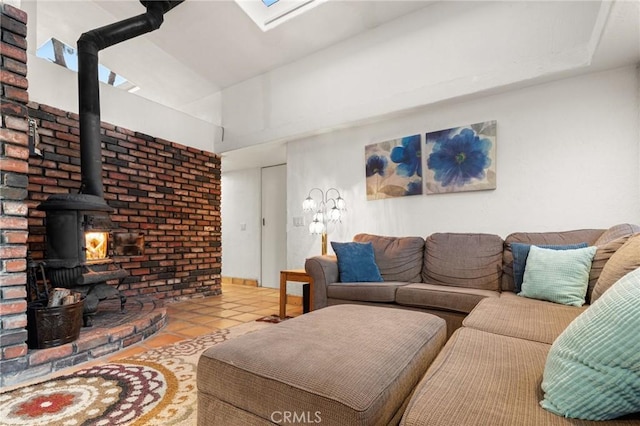 living room featuring a wood stove and light tile patterned flooring