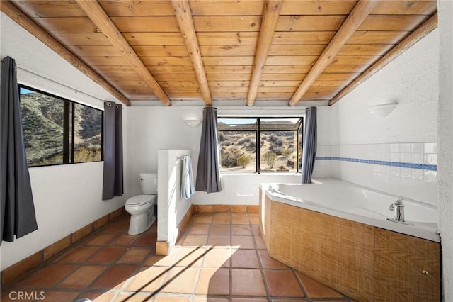 bathroom with wooden ceiling, lofted ceiling with beams, and a bath