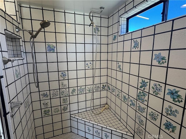 full bath with tiled shower