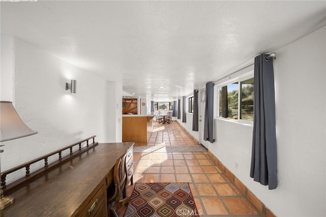 hallway featuring light tile patterned flooring