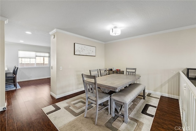 dining area with dark wood-style flooring, recessed lighting, ornamental molding, a textured ceiling, and baseboards