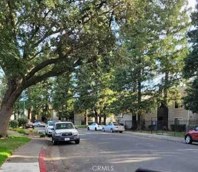 view of road featuring sidewalks and curbs