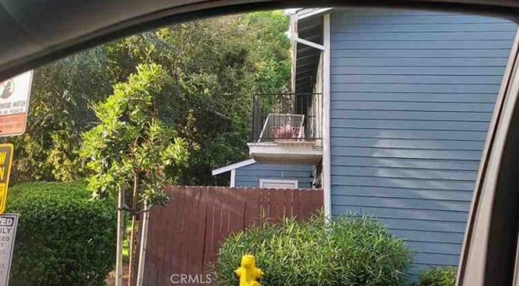 view of property exterior featuring fence