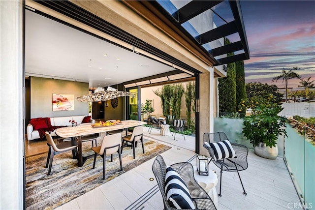 view of patio / terrace with outdoor dining area and a balcony