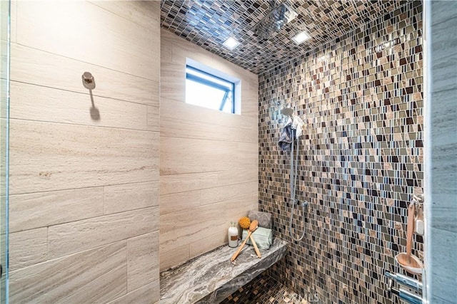 full bathroom with a tile shower