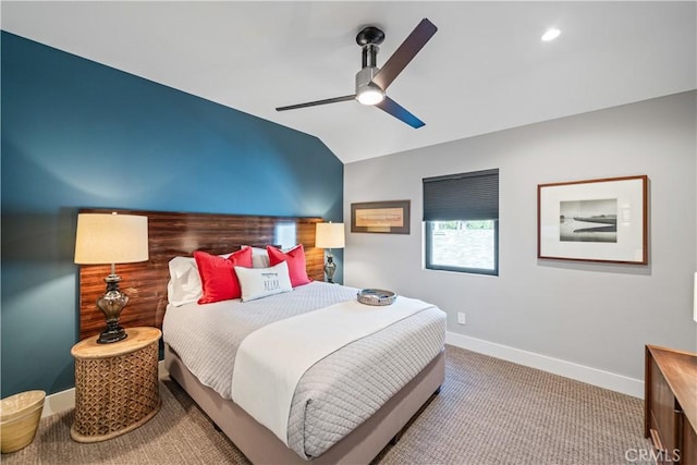 carpeted bedroom with vaulted ceiling, recessed lighting, a ceiling fan, and baseboards