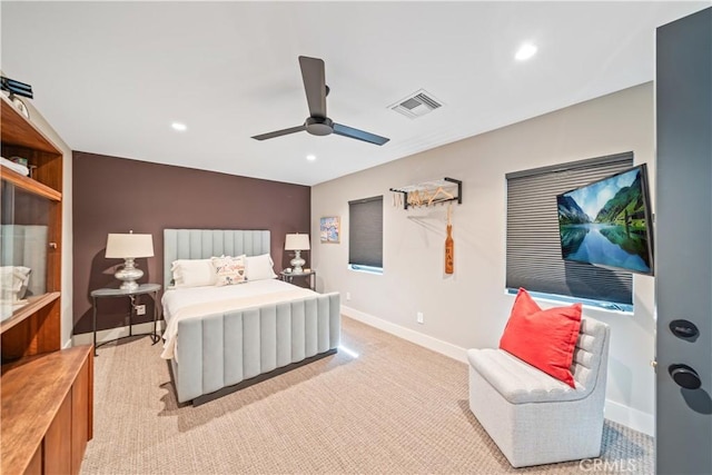 bedroom with recessed lighting, light carpet, a ceiling fan, visible vents, and baseboards