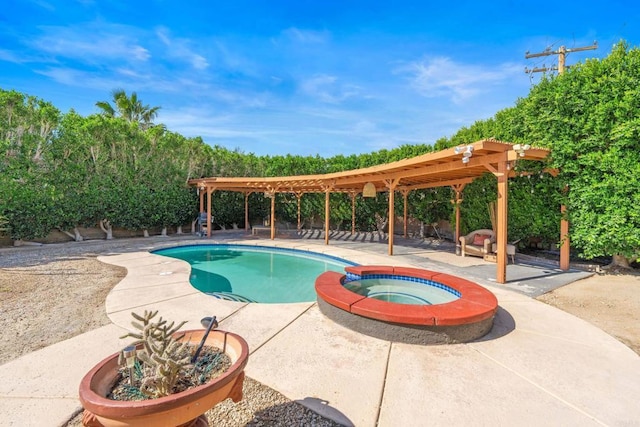 view of pool with a pool with connected hot tub, a fenced backyard, and a patio