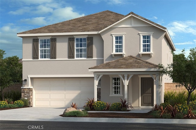 traditional-style home with a garage, driveway, stone siding, and stucco siding