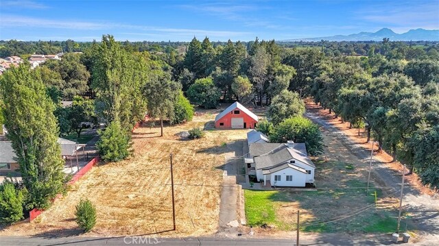 drone / aerial view with a view of trees