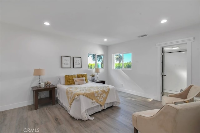 bedroom featuring recessed lighting, baseboards, visible vents, and light wood finished floors