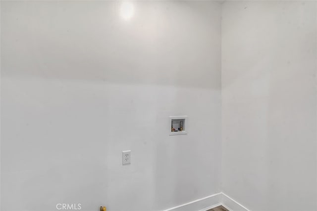 washroom featuring laundry area, washer hookup, and baseboards