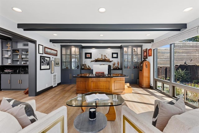 living room featuring light wood-type flooring, plenty of natural light, beamed ceiling, and recessed lighting