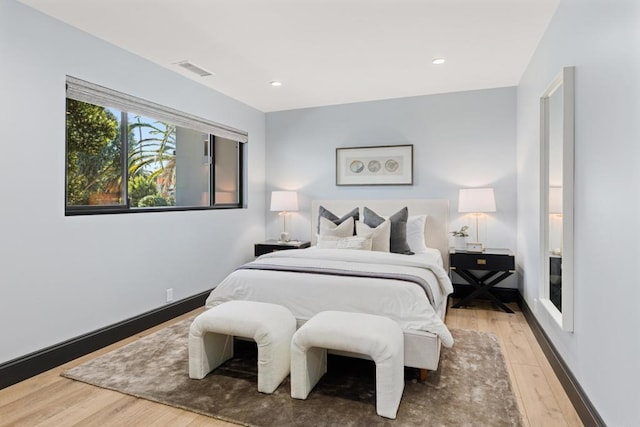 bedroom featuring recessed lighting, visible vents, and wood finished floors