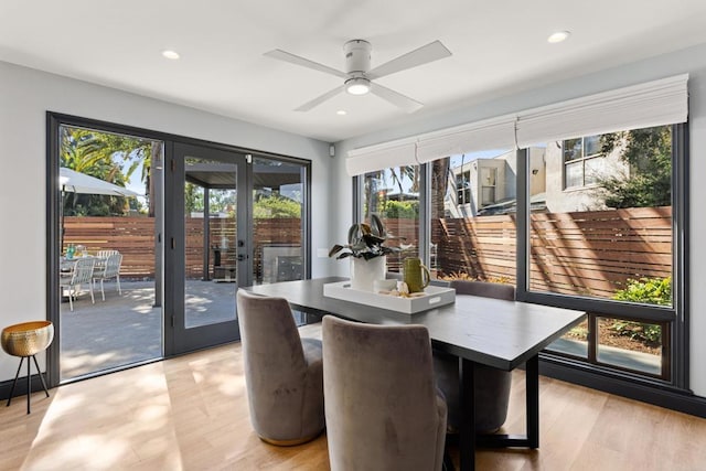 interior space featuring light wood-style flooring, a ceiling fan, french doors, and recessed lighting